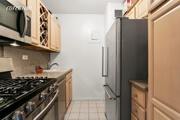 New York City Real Estate | View 301 East 79th Street, 18F | Kitchen -Stainless Appliances- wine rack | View 2
