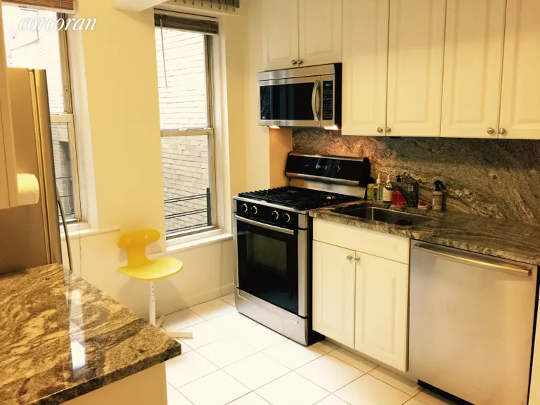 New York City Real Estate | View 321 East 43rd Street, 705 | Windowed south facing kitchen | View 2