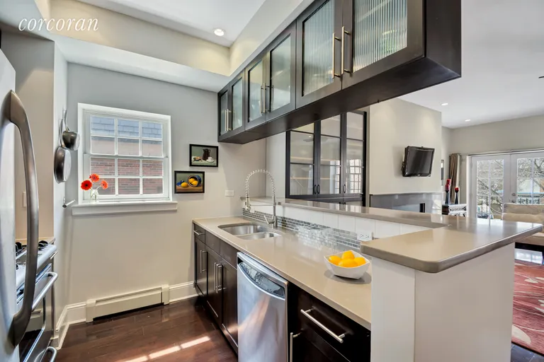 New York City Real Estate | View 1671 11th Avenue, 3E | Modern windowed kitchen with breakfast bar | View 3