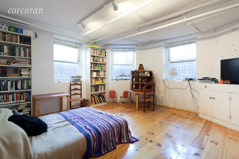 New York City Real Estate | View 39.5 Washington Square S, 1 | Lower level bedroom flooded w/ north & east light | View 4