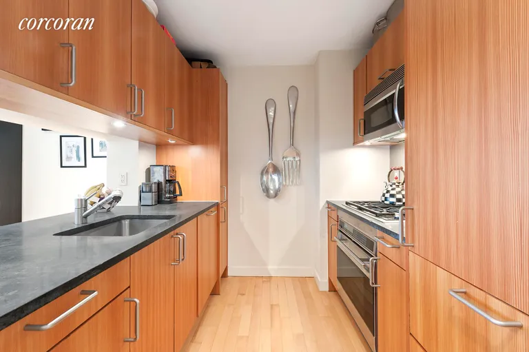 New York City Real Estate | View 450 East 83rd Street, 3K | Pass Through Kitchen with tons of storage space | View 2