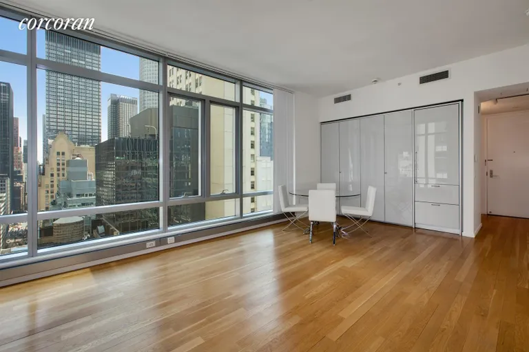 New York City Real Estate | View 18 West 48th Street, 21B | Living Room with Pullman Kitchen | View 2