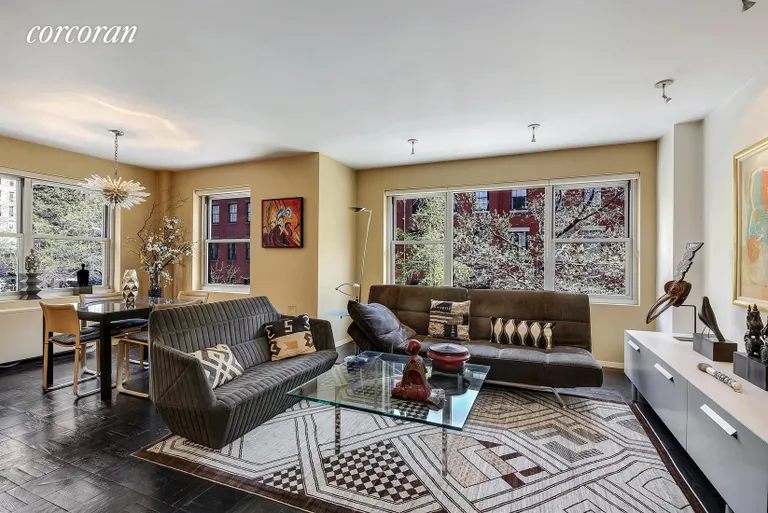 New York City Real Estate | View 20 East 9th Street, 3U | Windowed Corner Living Room/Dining Alcove | View 2