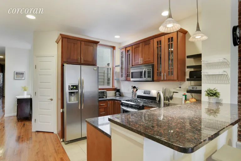 New York City Real Estate | View 658 Park Place, 9 | Handsome Kitchen with Breakfast Bar   | View 3