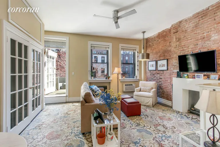 New York City Real Estate | View 111 West 70th Street, 4R | Sunken Living Room with 10' ceilings | View 2