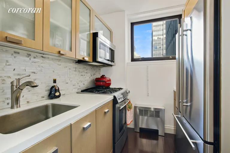 New York City Real Estate | View 212 East 47th Street, 27J | Kitchen w/ hidden dishwasher | View 3