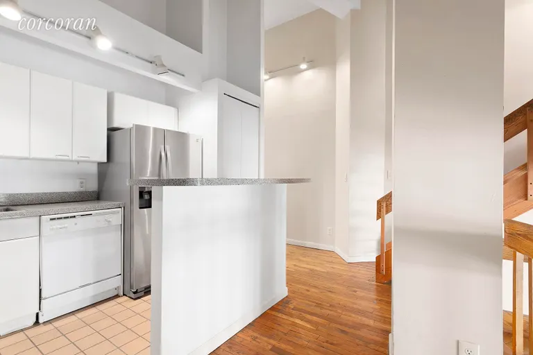 New York City Real Estate | View 130 Barrow Street, 214 | Second level with kitchen & full sized b’fast bar | View 4