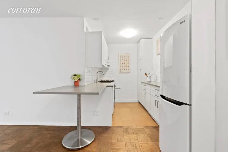 New York City Real Estate | View 115 East 9th Street, 9N | Kitchen with Dining | View 6