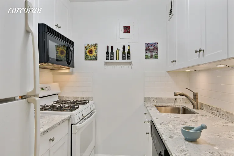 New York City Real Estate | View 301 East 69th Street, 14G | Renovated Kitchen with New Quartz Counters | View 3