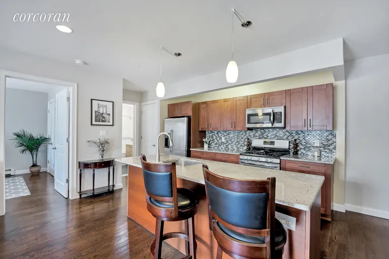 New York City Real Estate | View 1138 Ocean Avenue, 3I | Granite center island breakfast bar w sink | View 2