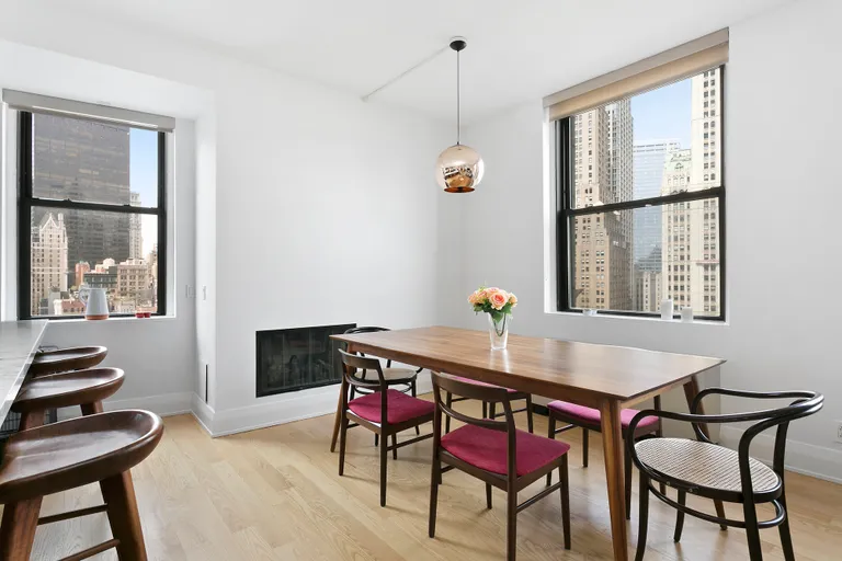 New York City Real Estate | View 150 Nassau Street, 19A | Beautiful dining area with fireplace | View 2