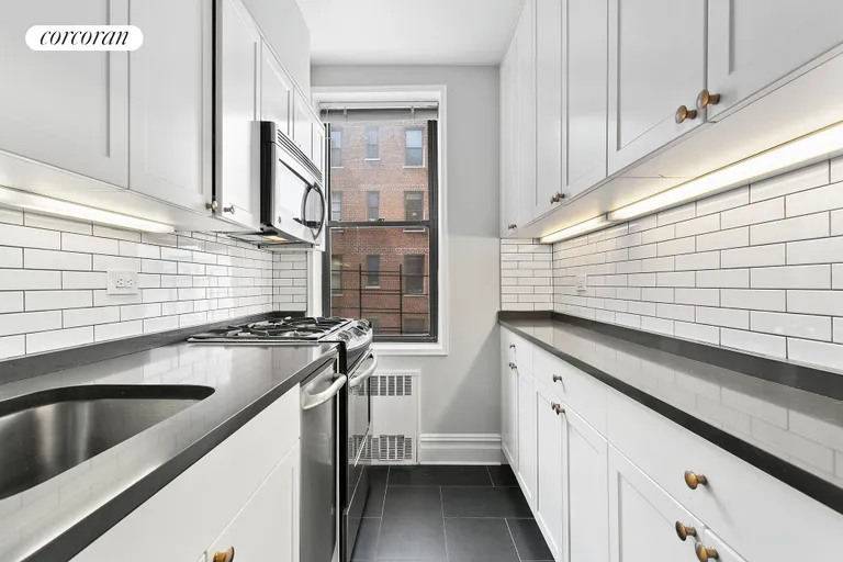 New York City Real Estate | View 30 East 9th Street, 4K | Renovated Windowed Kitchen open to Living Room  | View 3