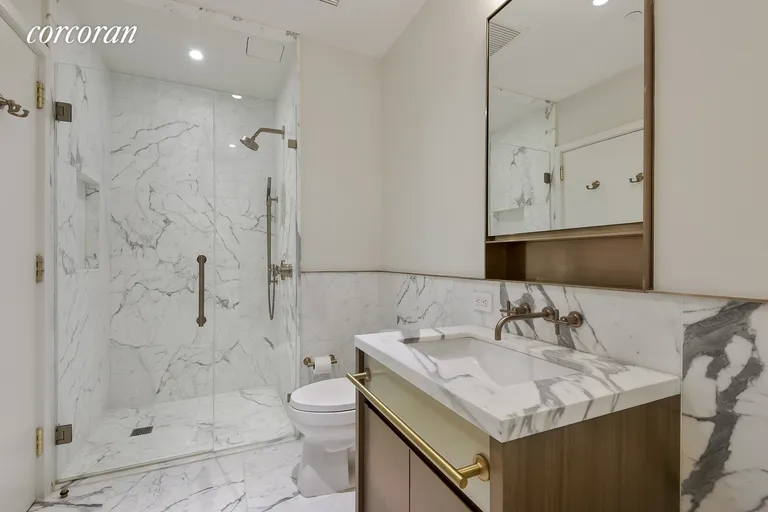 New York City Real Estate | View 305 East 51st Street, 29B | Marble Bathroom with Tub and Shower | View 4
