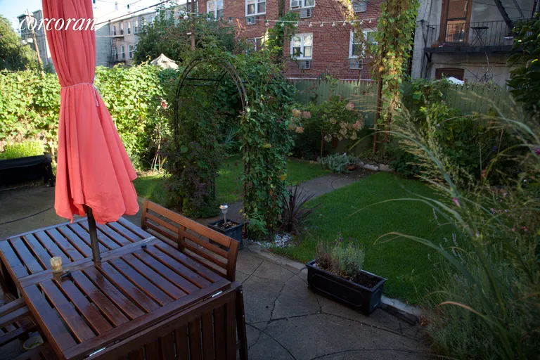 New York City Real Estate | View 112 2nd Place | bright garden area with lawn | View 8