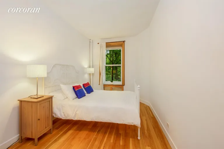 New York City Real Estate | View 552 Riverside Drive, 1A | Bedroom with park views | View 2