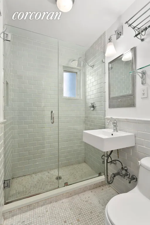 New York City Real Estate | View 362 West 20th Street, 4 | Beautiful Marble Bath with Glass Shower | View 3