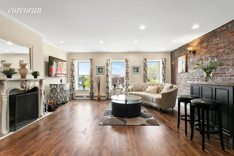 New York City Real Estate | View 85 Joralemon Street, 3 | Living room with beautiful wood burning fireplace | View 2