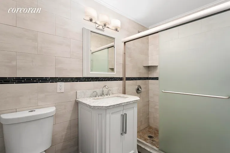 New York City Real Estate | View 85 Joralemon Street, 3 | Floor to ceiling tiled bathroom | View 5