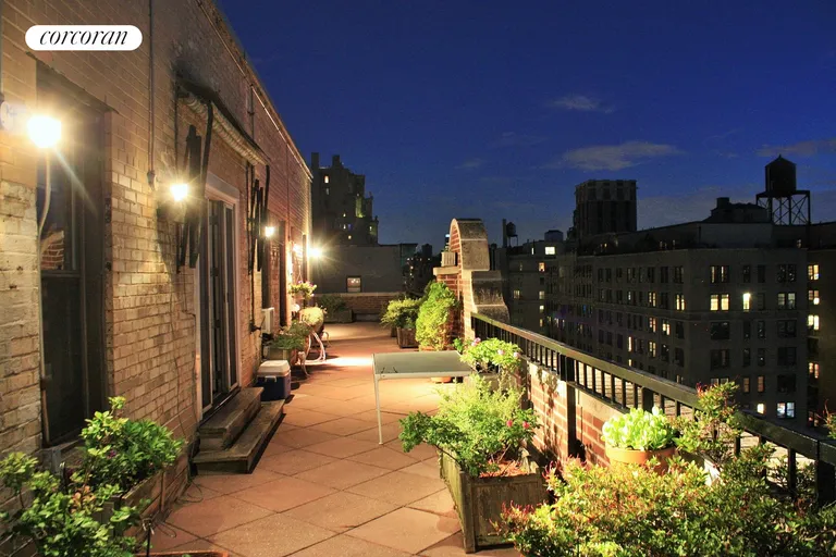 New York City Real Estate | View 710 West End Avenue, PHA | Night lights on the terrace, looking south. | View 9