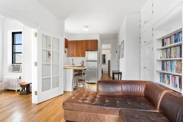 New York City Real Estate | View 96 Perry Street, B24 | Reverse view Living Room to open Kitchen | View 2