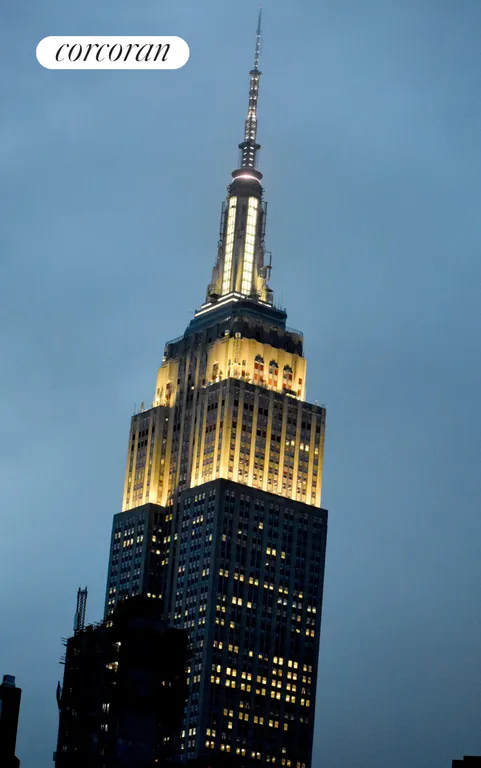 New York City Real Estate | View 140 East 28th Street, 10D | Empire State at dusk.  | View 2