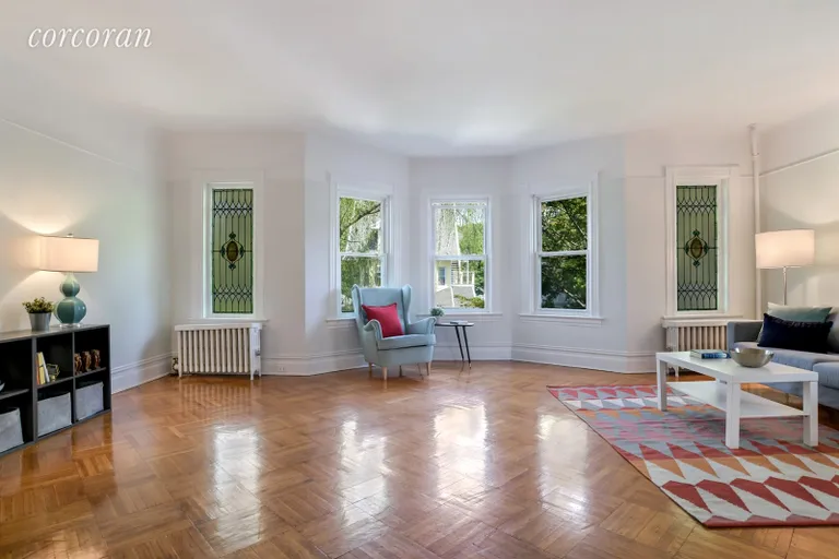 New York City Real Estate | View 452 Marlborough Road | Grand 23 ft wide living room w/bay & stained glass | View 4