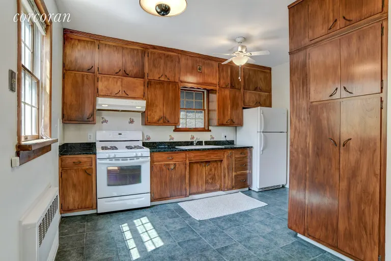 New York City Real Estate | View 452 Marlborough Road | Eat in kitchen open to the dining room | View 7
