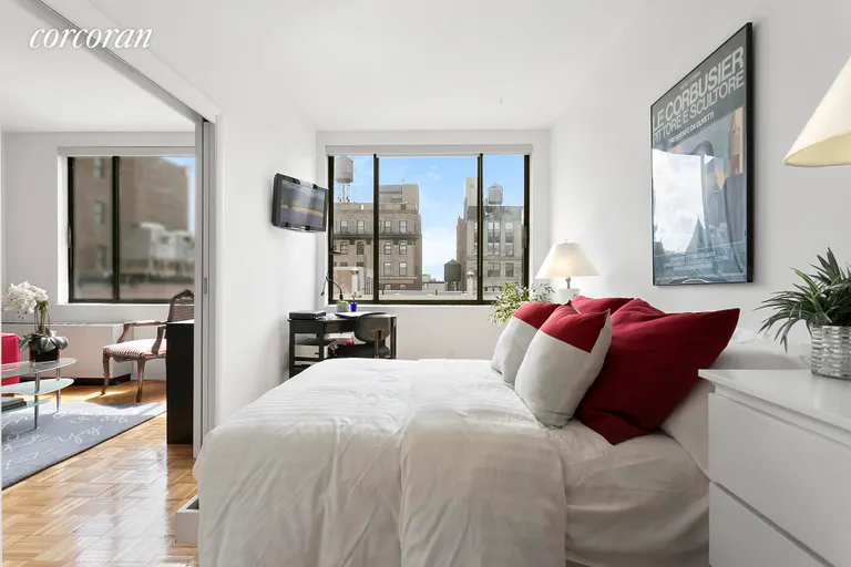 New York City Real Estate | View 77 Bleecker Street, 1215 | Sunny and airy bedroom with a large window. | View 3