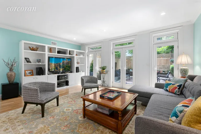 New York City Real Estate | View 932 President Street, 1A | Beautifully lit living room with garden views | View 2