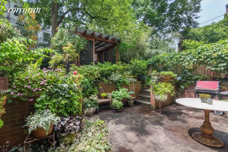 New York City Real Estate | View 36 Verandah Place | Brick patio off the kitchen | View 7