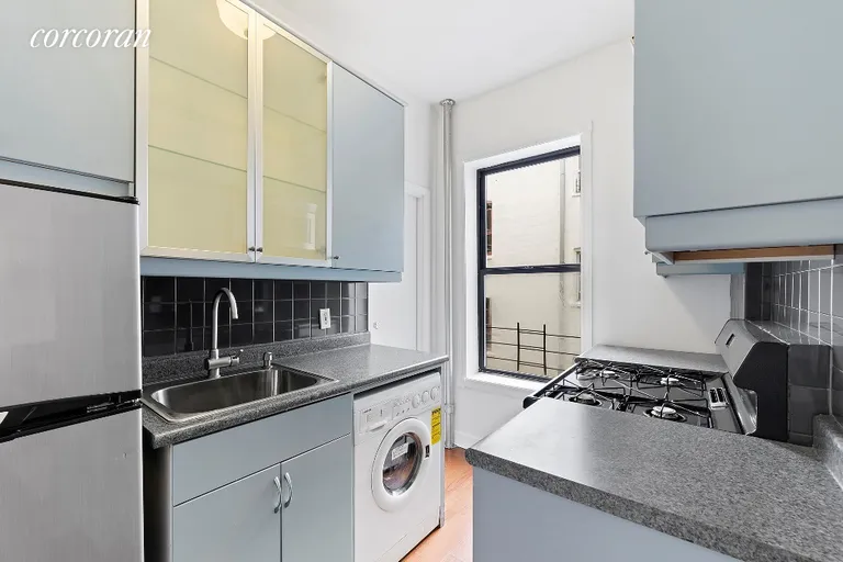 New York City Real Estate | View 311 East 3rd Street, 25 | Kitchen with Washer/Dryer | View 3