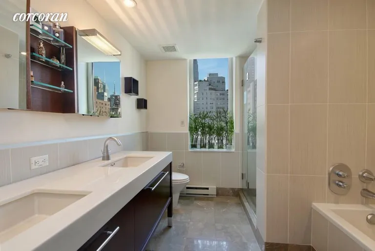 New York City Real Estate | View 225 East 34th Street, 9E | Master Bath w/ 2 sinks, soaking tub, and shower | View 7