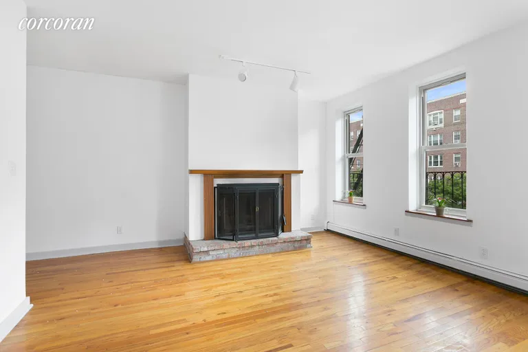 New York City Real Estate | View 286 Saint Johns Place, 3A | Wood-burning fireplace and large windows. | View 2
