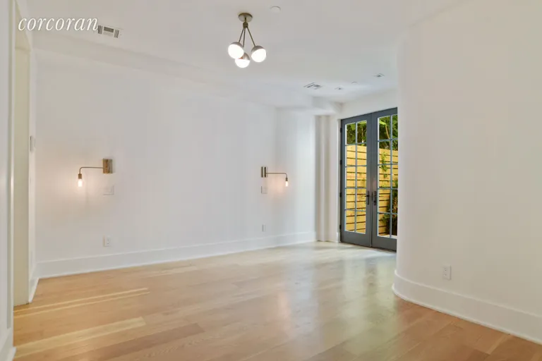 New York City Real Estate | View 633 Prospect Place, 1 | Master Bed with entrance to Garden | View 2