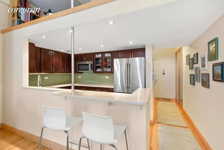 New York City Real Estate | View 148 West 23rd Street, 9B | Open Kitchen with Breakfast Bar | View 3