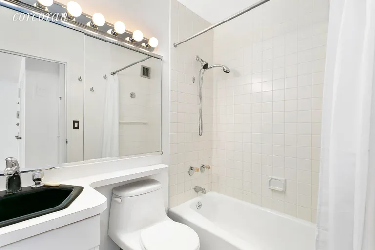 New York City Real Estate | View 300 East 54th Street, 9J | Sleek and Bright Bathroom | View 4
