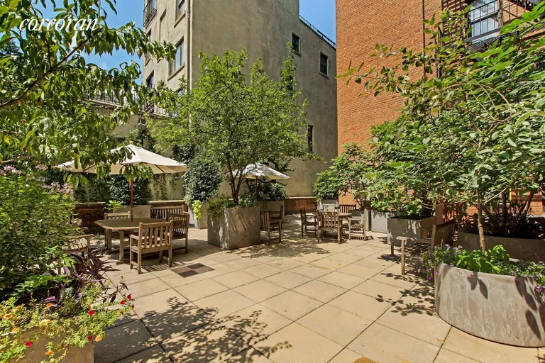 New York City Real Estate | View 350 BLEECKER STREET, 1C | Common courtyard w/bbq | View 7