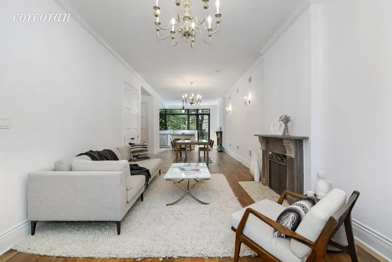 New York City Real Estate | View 282 Clifton Place, 1 | Open Living /Dining with WOOD BURNING FIREPLACE | View 3
