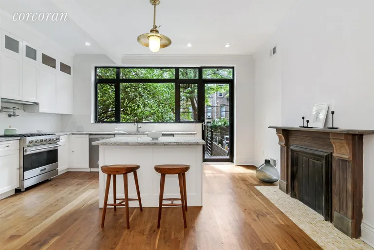New York City Real Estate | View 282 Clifton Place, 1 | Kitchen with Access to Deck and PRIVATE Backyard  | View 2