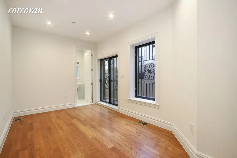 New York City Real Estate | View 139 West 136th Street, 1 | Master Bedroom w/ En-Suite Bath & Patio | View 5