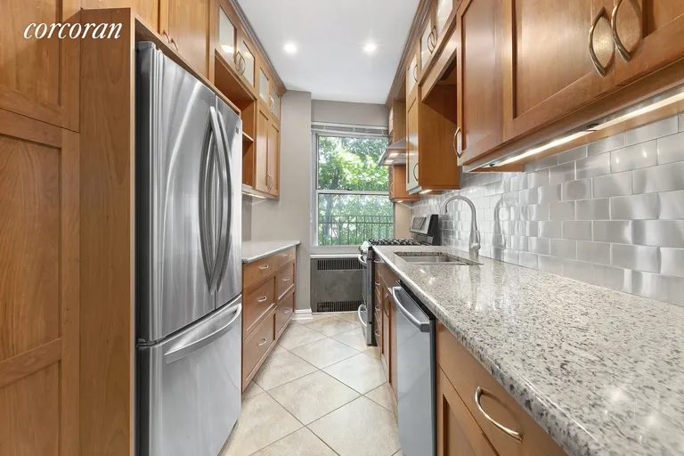 New York City Real Estate | View 75-40 Austin Street, 5FR | Windowed galley kitchen featuring custom cabinetry | View 3