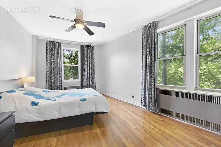 New York City Real Estate | View 75-40 Austin Street, 5FR | Spacious corner bedroom with ample storage options | View 5