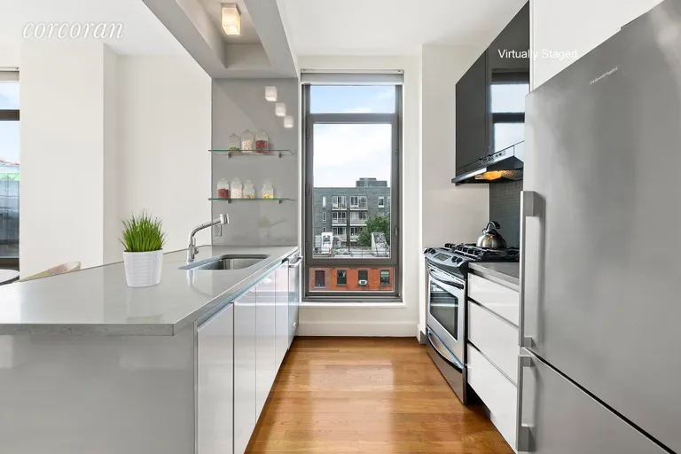 New York City Real Estate | View 315 Gates Avenue, 5E | Windowed kitchen with top of the line appliances | View 4