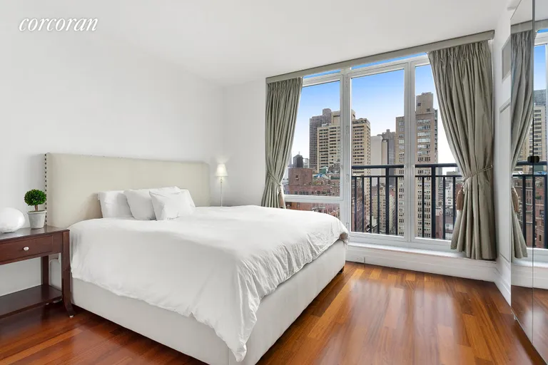 New York City Real Estate | View 45 Park Avenue, 1605 | King-sized bedroom with floor-to-ceiling windows | View 2