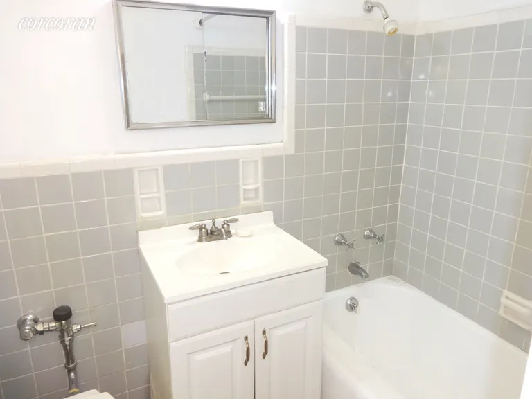 New York City Real Estate | View 191 Willoughby Street, 7K | Tiled bath with tub | View 10