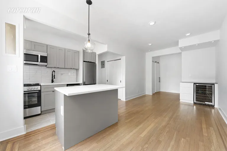 New York City Real Estate | View 59-11 Queens Boulevard, 1A | Wine fridge, and ample storage options. | View 7