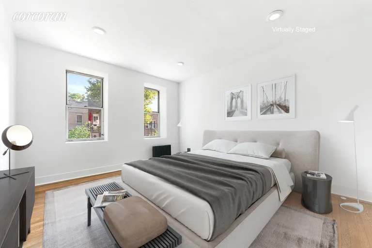 New York City Real Estate | View 59-11 Queens Boulevard, 1A | King-sized bedroom featuring a deep closet | View 3