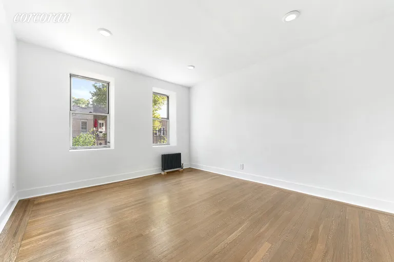 New York City Real Estate | View 59-11 Queens Boulevard, 1A | King-sized bedroom featuring a deep closet | View 9