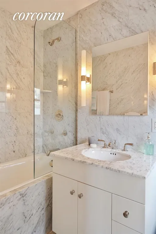 New York City Real Estate | View 175 East 74th Street, 12A | Windowed Master Bathroom, marble & Waterworks | View 6