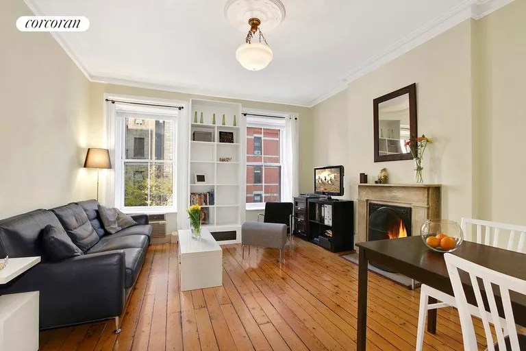 New York City Real Estate | View 184 East 93rd Street, 2 | Living Room with Wood Burning Fireplace | View 3